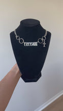 Load and play video in Gallery viewer, X RING CROSS CHOKER
